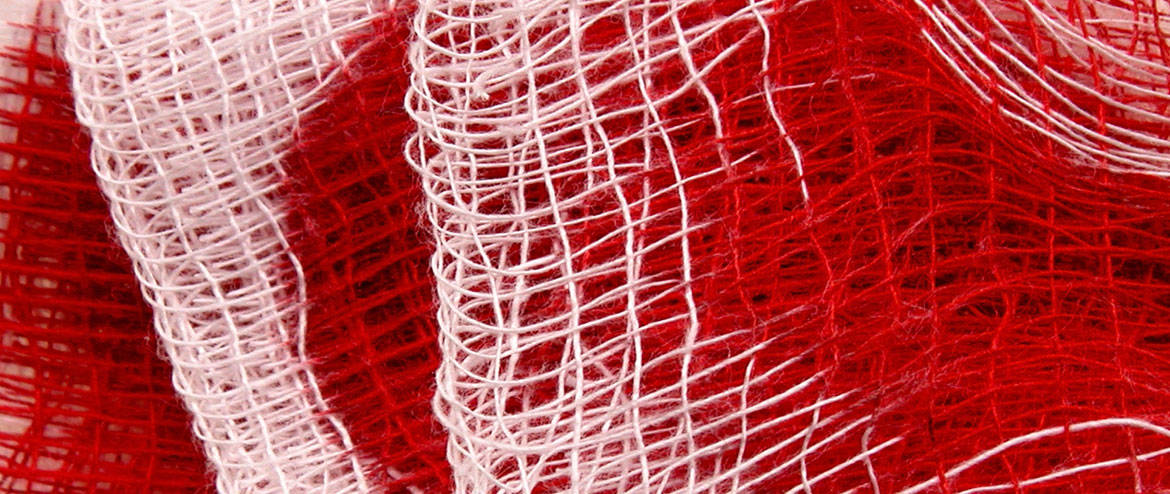 Red bag medical waste including used gauze and biohazard materials.